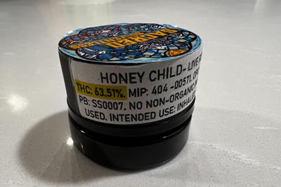 A concentrate container with a label stating there is 63% THC inside the product.